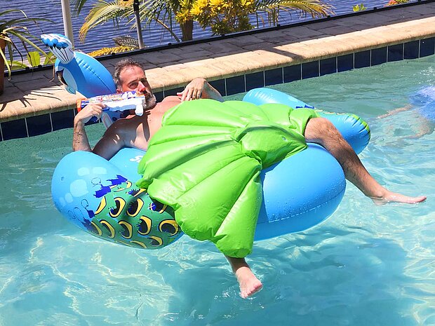 Chris enjoying the morning on a pool float in a private pool in Cape Coral, Florida